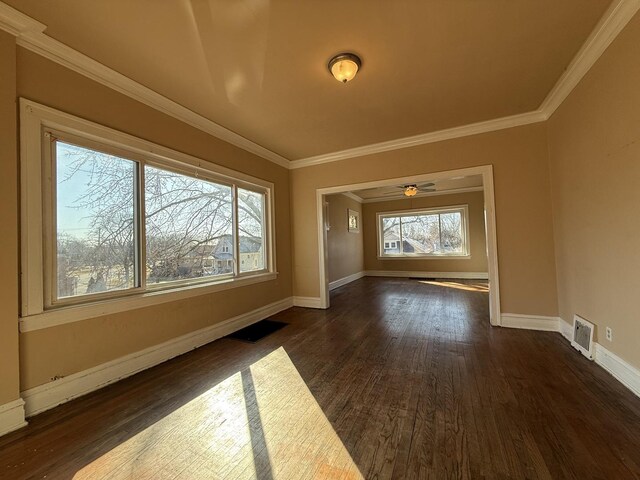 bedroom with dark hardwood / wood-style flooring, ceiling fan, and ornamental molding