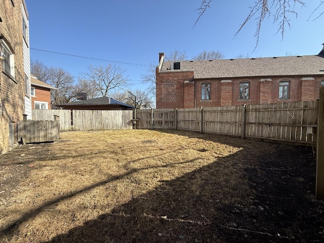 view of yard featuring a fenced backyard