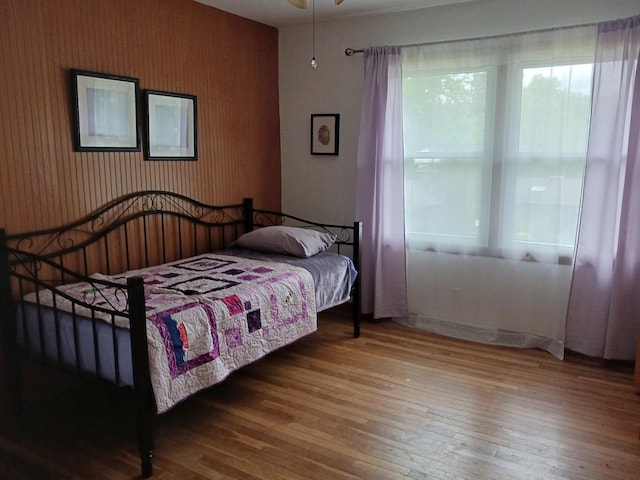 bedroom with hardwood / wood-style floors