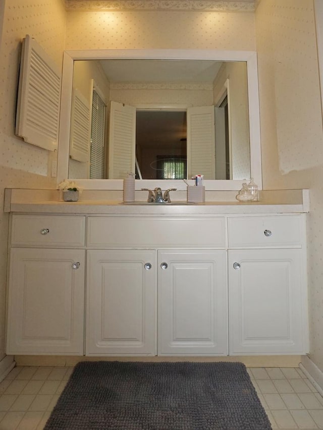 bathroom with tile patterned flooring and vanity