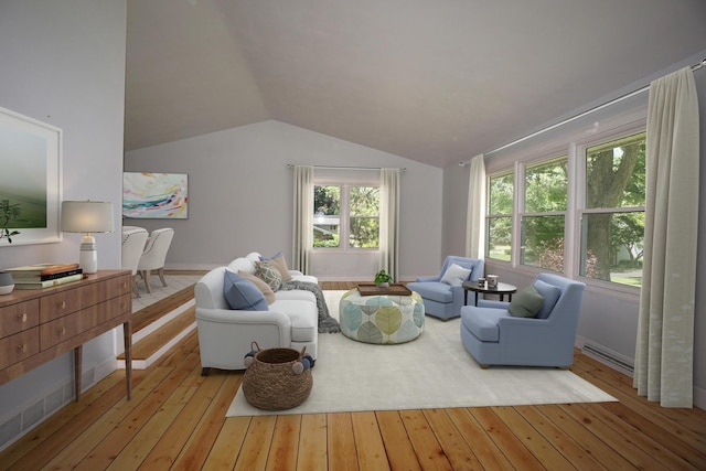 sitting room with lofted ceiling and light wood-type flooring