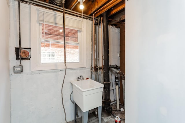 utility room featuring a sink