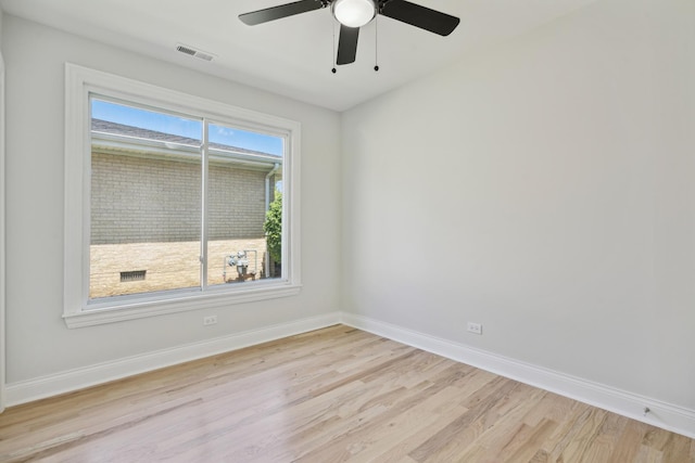 unfurnished room featuring light hardwood / wood-style flooring and ceiling fan