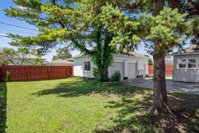 view of yard with a garage and an outdoor structure