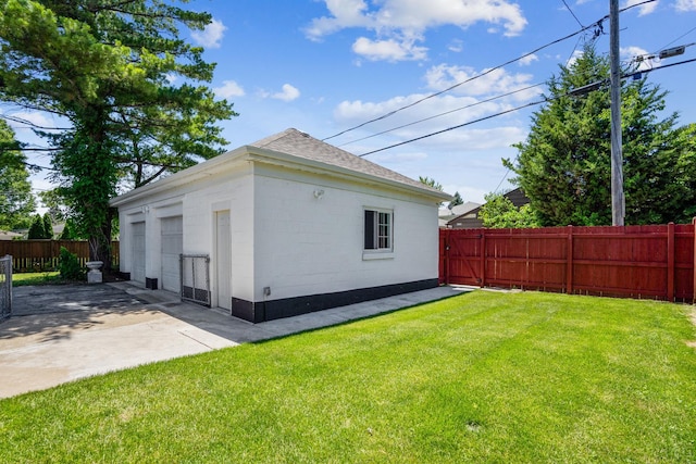 view of side of home featuring a patio area and a yard