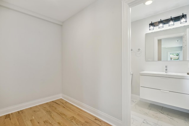 bathroom featuring hardwood / wood-style flooring and vanity