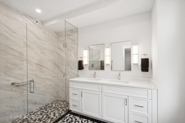 bathroom with an enclosed shower, vanity, and tile patterned floors