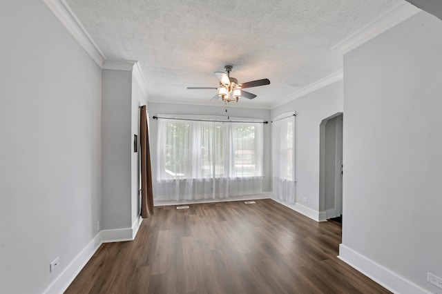 spare room with dark wood-type flooring, a textured ceiling, ceiling fan, and ornamental molding