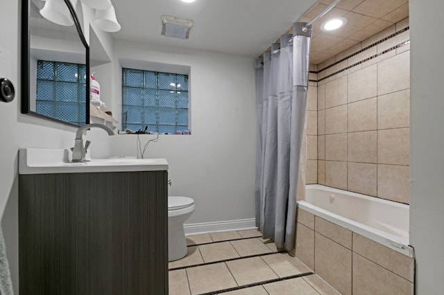 full bathroom with tile patterned floors, vanity, shower / bath combo, and toilet