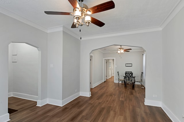 interior space featuring dark hardwood / wood-style flooring, a textured ceiling, and crown molding