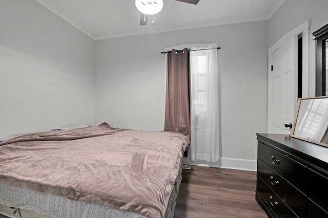 bedroom featuring dark wood-type flooring and ceiling fan