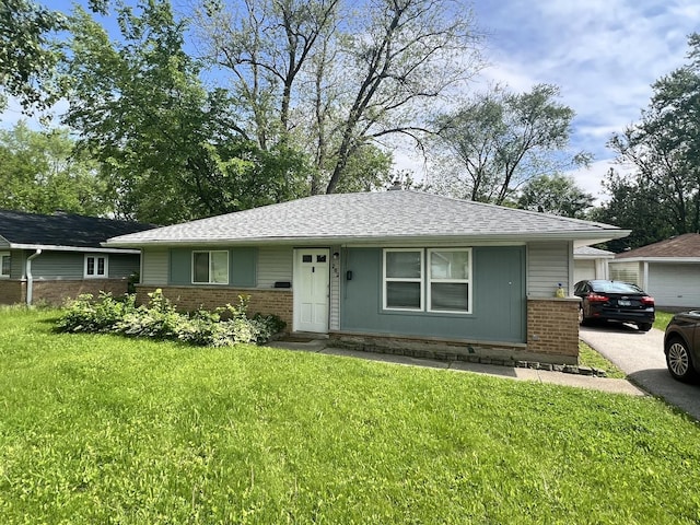 single story home with a front yard