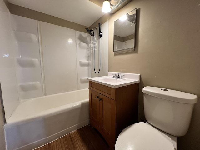 full bathroom featuring shower / tub combination, hardwood / wood-style floors, vanity, and toilet