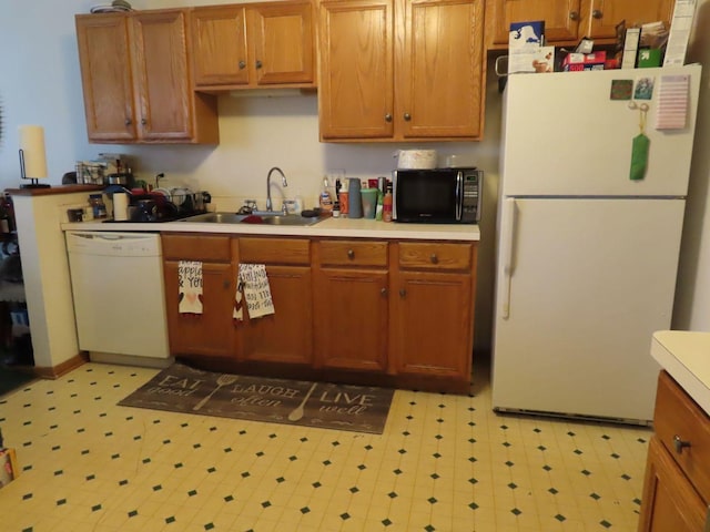 kitchen with white appliances and sink