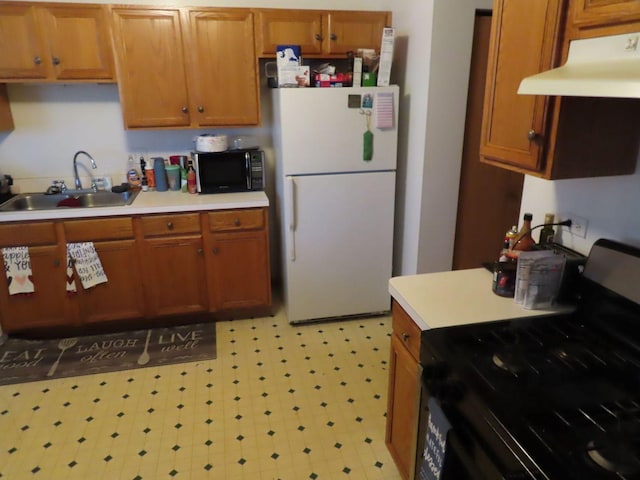 kitchen featuring sink and black appliances