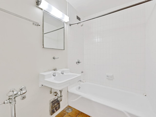 bathroom featuring tile patterned flooring and shower / bathtub combination