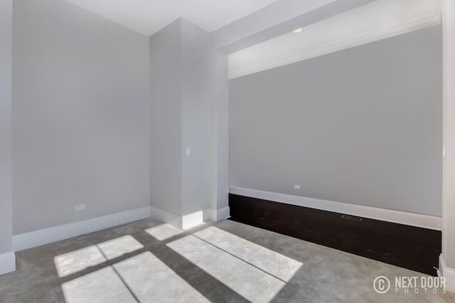 empty room with light colored carpet