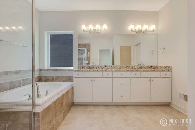 bathroom with separate shower and tub, tile patterned flooring, and vanity