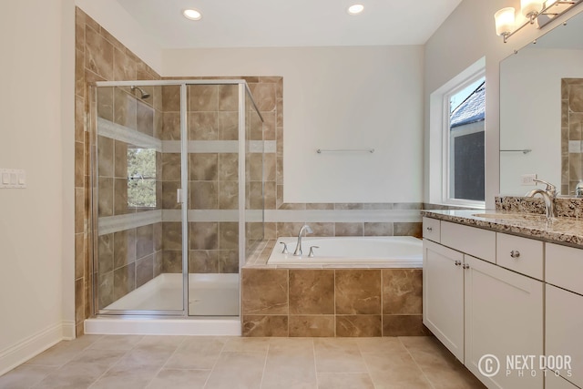 bathroom featuring tile patterned floors, vanity, and plus walk in shower