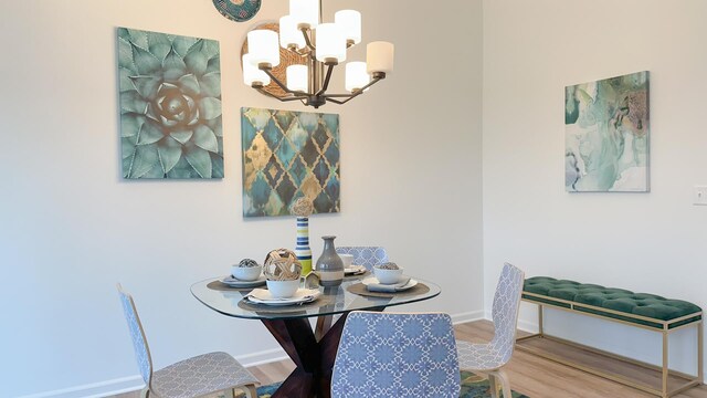 dining room with a notable chandelier and wood-type flooring