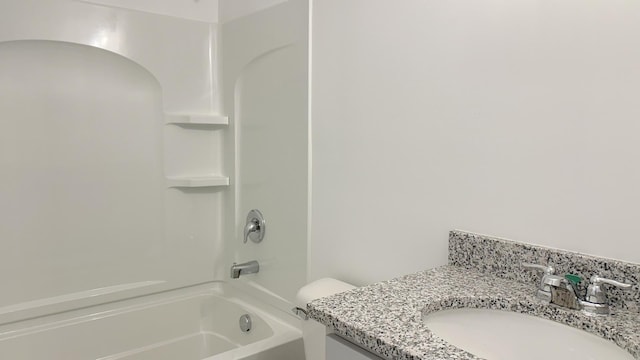 full bath featuring bathtub / shower combination, vanity, and toilet