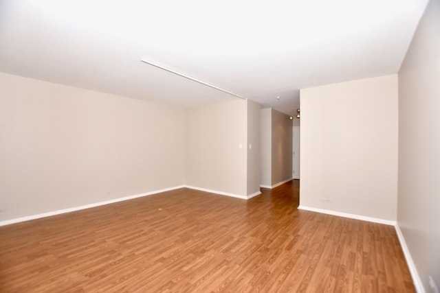 spare room featuring hardwood / wood-style floors