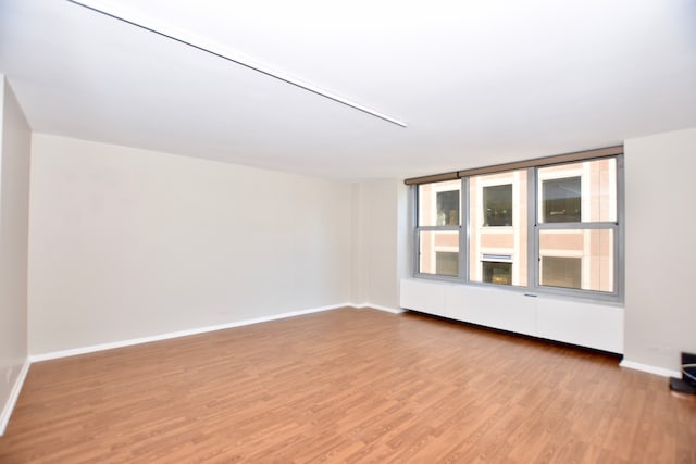 empty room featuring hardwood / wood-style flooring