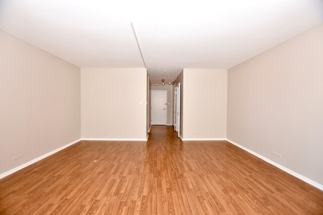 empty room featuring wood-type flooring