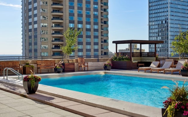 view of swimming pool with a patio area