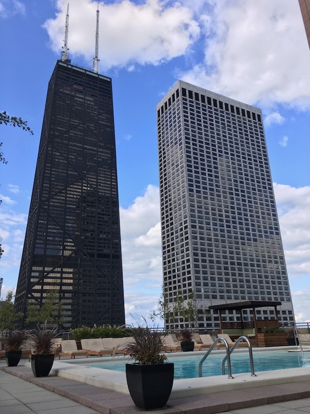 view of building exterior with a community pool