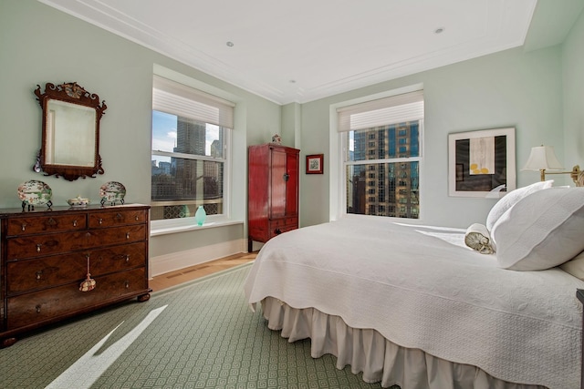 bedroom featuring light hardwood / wood-style floors and ornamental molding