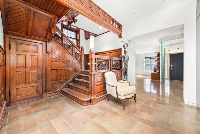 stairs featuring a high ceiling