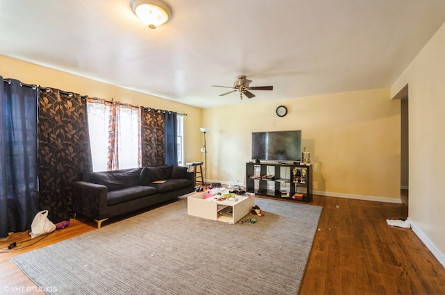 living room with ceiling fan and hardwood / wood-style flooring