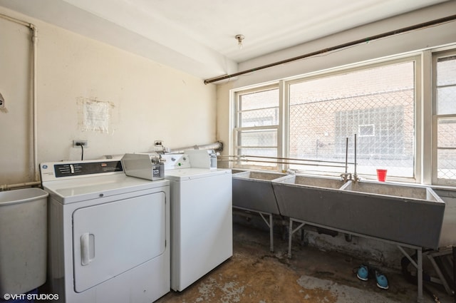 laundry area featuring washing machine and clothes dryer