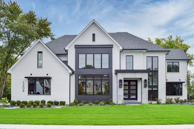 modern inspired farmhouse featuring french doors and a front yard