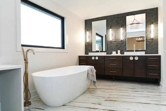 15W601 Grant St, Burr Ridge, IL 60527 - bathroom featuring a tub, vanity, and a notable chandelier