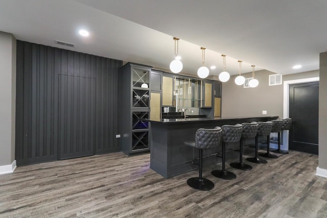 15W601 Grant St, Burr Ridge, IL 60527 - bar with sink, hanging light fixtures, and dark hardwood / wood-style floors