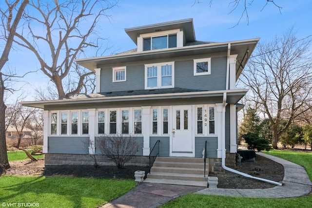 american foursquare style home with entry steps