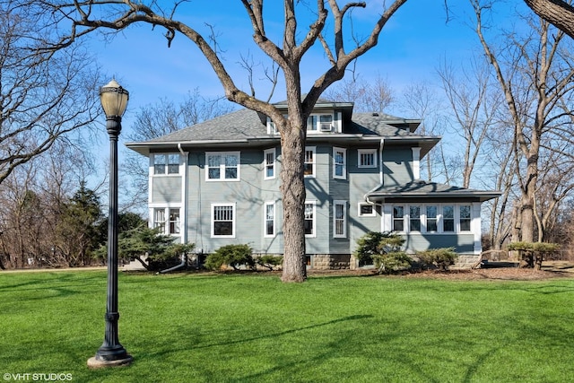 back of house featuring a yard