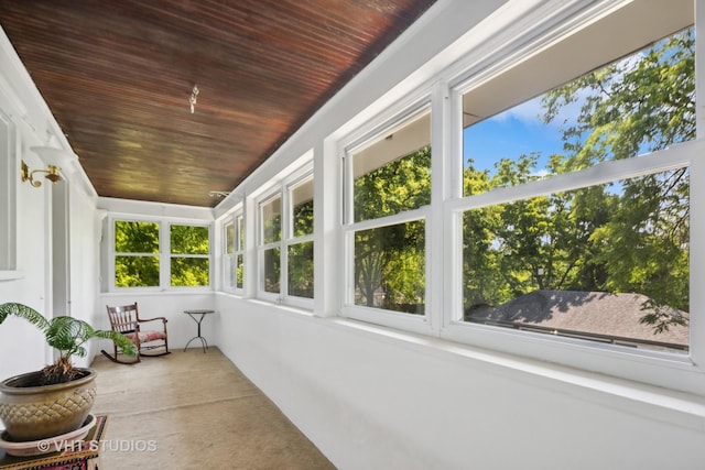 sunroom with wooden ceiling