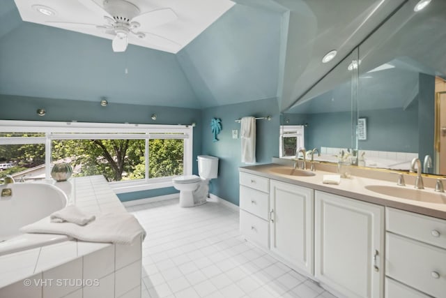 bathroom featuring double vanity, tile patterned floors, lofted ceiling, and a sink