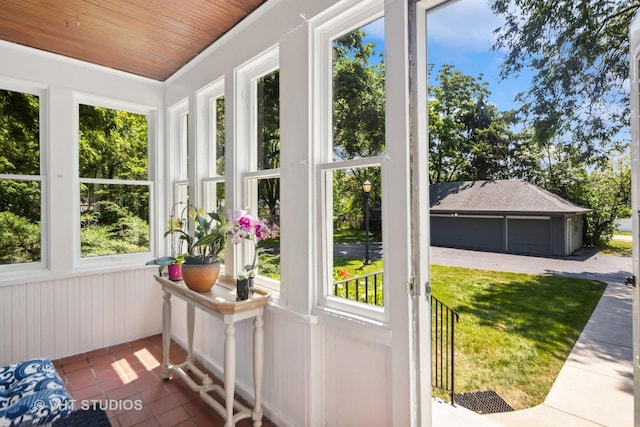 sunroom / solarium featuring wooden ceiling