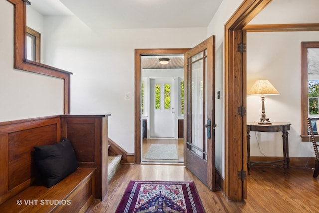 foyer entrance with stairway and wood finished floors