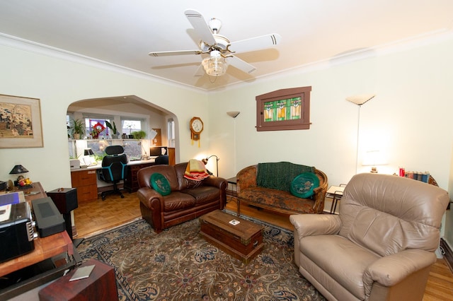 living room featuring ceiling fan and ornamental molding