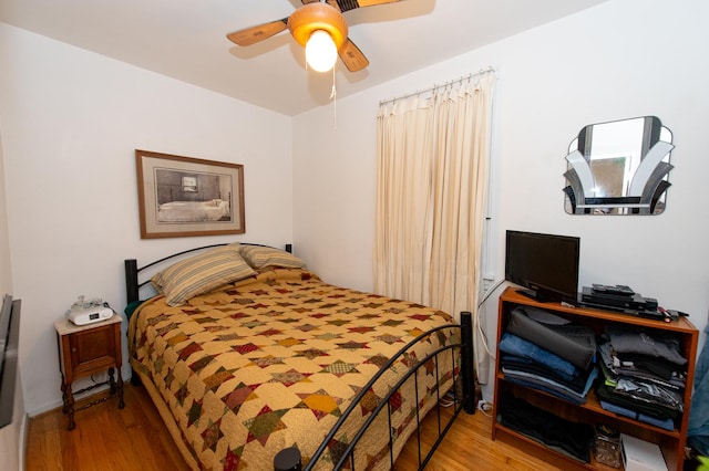 bedroom featuring ceiling fan and light hardwood / wood-style floors