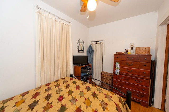 bedroom featuring ceiling fan and hardwood / wood-style floors