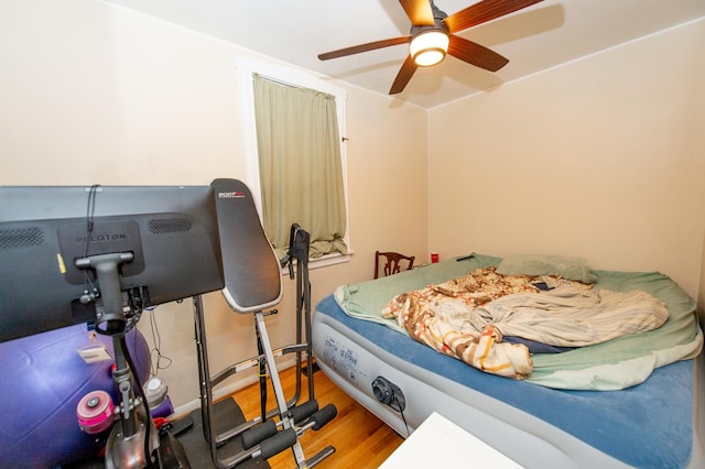 bedroom featuring hardwood / wood-style floors and ceiling fan