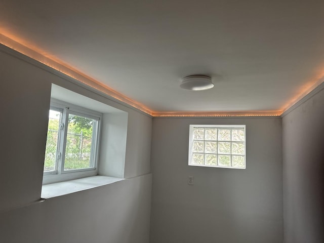 empty room featuring ornamental molding