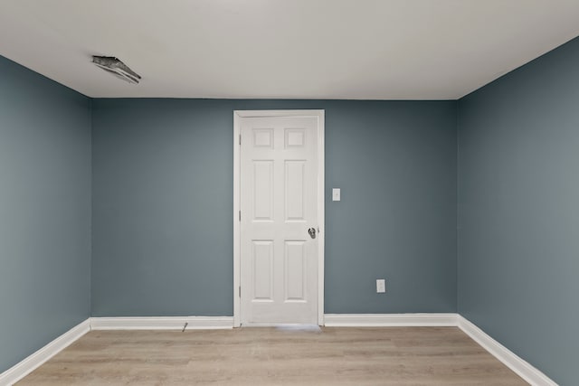 spare room featuring light wood-type flooring