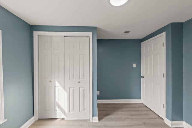 unfurnished bedroom featuring light hardwood / wood-style floors